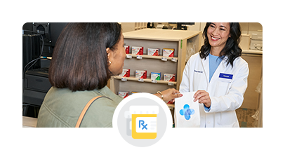 A happy customer receiving a prescription from a kind pharmacist.