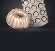 Baking tins on black background