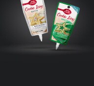 Tubes of frosting on black background