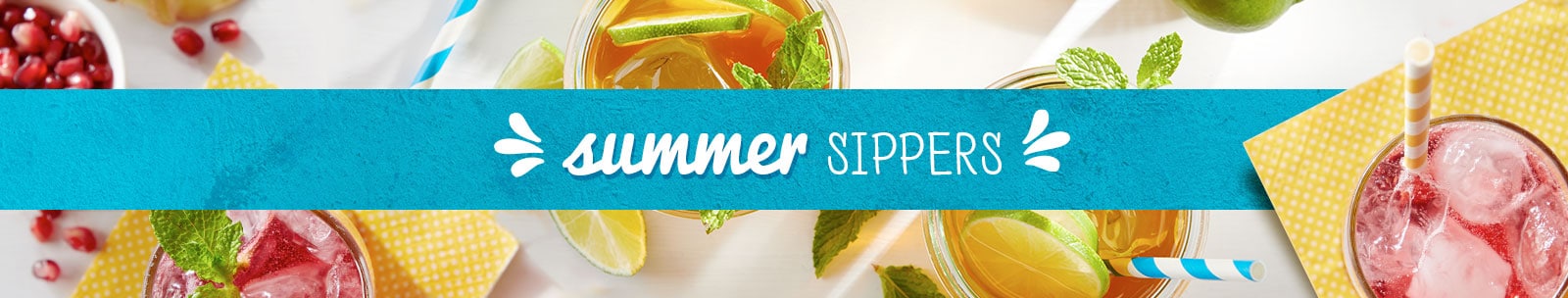 Summery cocktails or beverages with fresh fruit on rim Summery cocktails or beverages with fresh fruit on rim