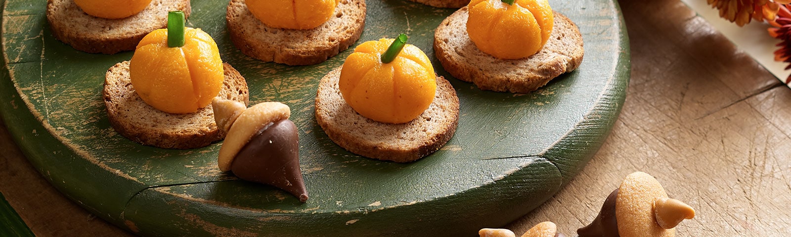 Chocolate and pumpkin spice kiss candies shaped as acorns