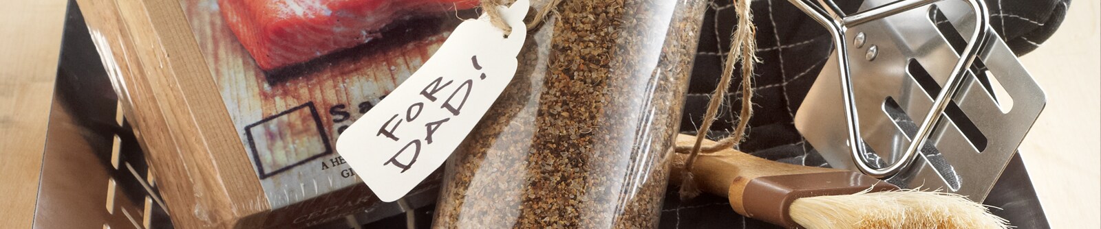 Seasoning and grill utensils with a note that reads "For Dad!"
