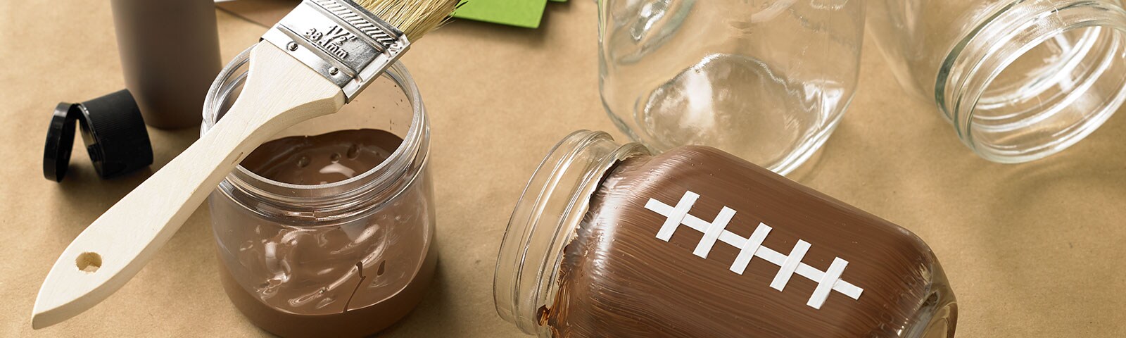 Mason jars painted as footballs Mason jars painted as footballs