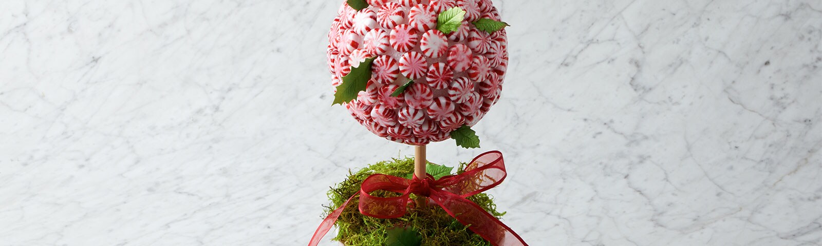 Round peppermint candy tree with a red ribbon Round peppermint candy tree with a red ribbon