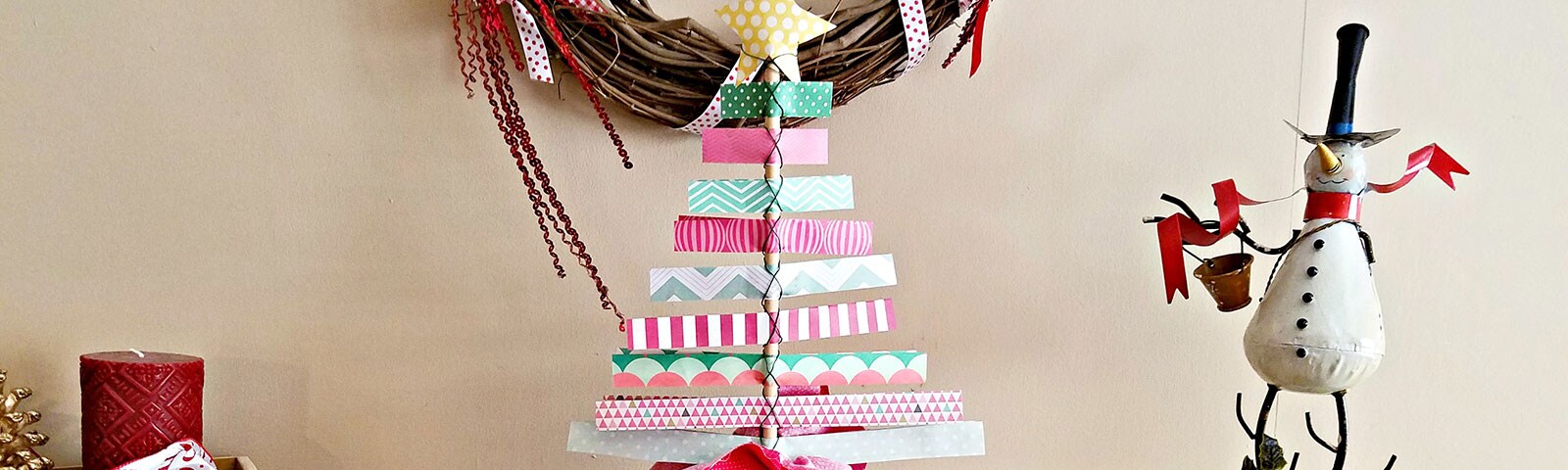 Scrapbook paper made into a Christmas tree standing on a table Scrapbook paper made into a Christmas tree standing on a table