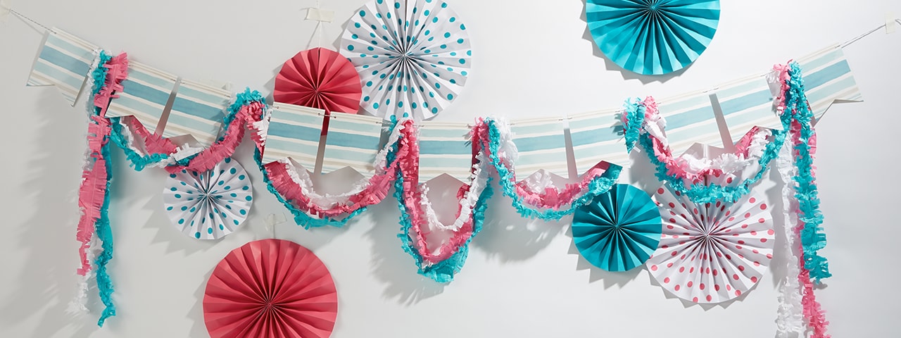 Colorful hanging garlands, streamers and folded paper origami Colorful hanging garlands, streamers and folded paper origami